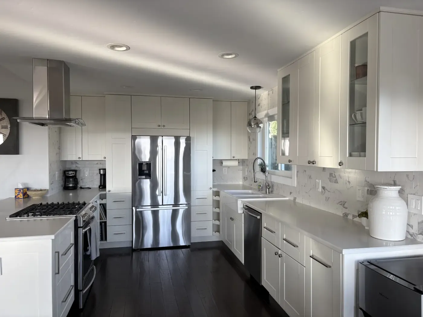 Grey and white kitchen with marble backsplash